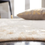 SAFAVIEH Faux Cow Hide Masuda Animal Rug