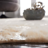 SAFAVIEH Faux Cow Hide Masuda Animal Rug