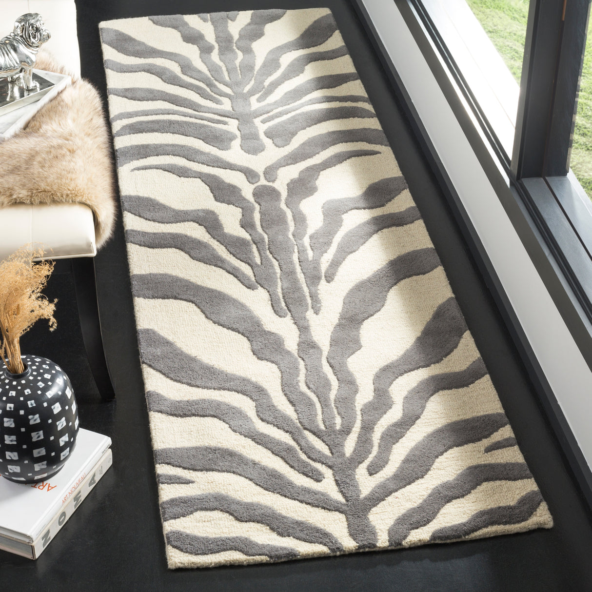 SAFAVIEH Handmade Cambridge Rikey Animal Print Wool Rug