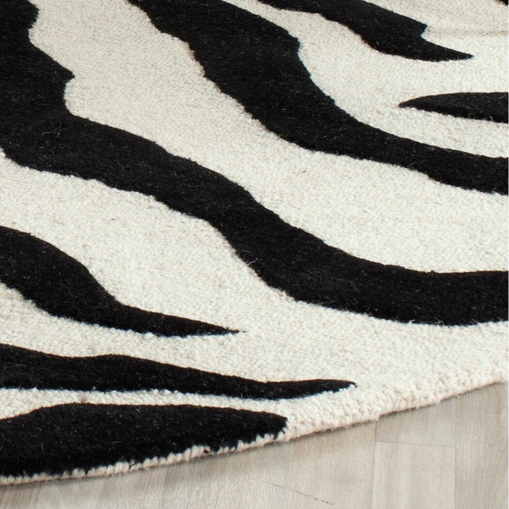 SAFAVIEH Handmade Cambridge Rikey Animal Print Wool Rug