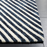 SAFAVIEH Handmade Ebony Nataliea Modern Wool Rug