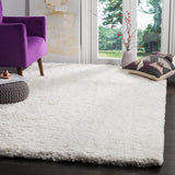 SAFAVIEH Handmade Florence Shag Isamar Solid Polyester Rug