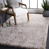 SAFAVIEH Handmade Latifah Shag Rositha Solid Polyester Rug