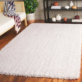 SAFAVIEH Handmade Luxe Gianna Gezina Shag Rug