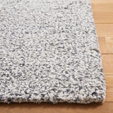 SAFAVIEH Handmade Ortanta Shag Bibeta Wool Rug