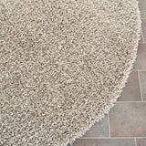 SAFAVIEH Handmade Rubi Shag Mevlide Solid Polyester Rug