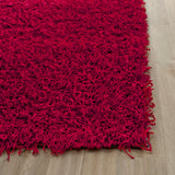 SAFAVIEH Handmade Rubi Shag Mevlide Solid Polyester Rug