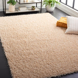 SAFAVIEH Handmade Rubi Shag Mevlide Solid Polyester Rug