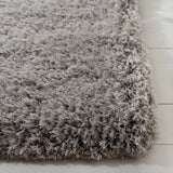 SAFAVIEH Handmade Ryann Shag Anneclaar Solid Polyester Rug