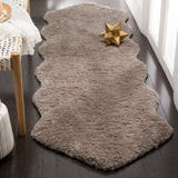 SAFAVIEH Handmade Sheep Shag Nurhayat Solid Rug