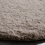 SAFAVIEH Handmade Sheep Shag Nurhayat Solid Rug