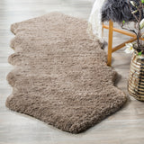 SAFAVIEH Handmade Sheep Shag Nurhayat Solid Rug