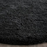 SAFAVIEH Handmade Sheep Shag Nurhayat Solid Rug