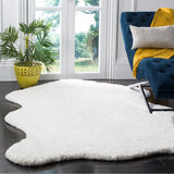 SAFAVIEH Handmade Sheep Shag Nurhayat Solid Rug