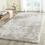 SAFAVIEH Handmade South Beach Jayla Shag Solid Polyester Rug