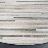 SAFAVIEH Handmade Studio Leather Carisa Natural Hide Leather Rug