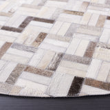 SAFAVIEH Handmade Studio Leather Yadira Mid-Century Modern Rug