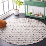 SAFAVIEH Handmade Studio Leather Yadira Mid-Century Modern Rug